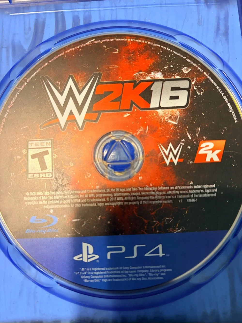 WWE 16 (PS4) Video Game - Black & Red Cover